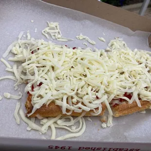 The cheese never goes in the oven just the bread