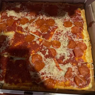 a pepperoni pizza in a box