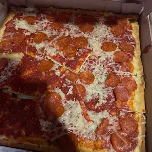 a pepperoni pizza in a box