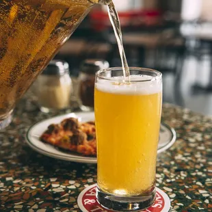 a beer being poured into a glass