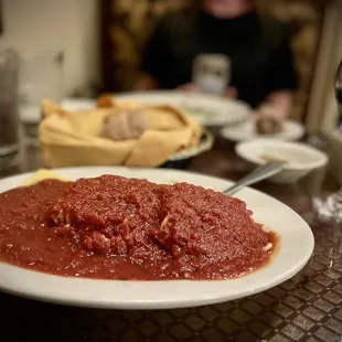 a plate of spaghetti and meat