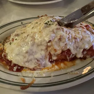 Meat lovers calzone with cheese baked on top