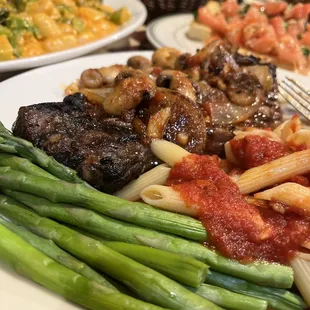New York Streak with grilled Mushrooms and Onions asparagus and Penne,  Gnocchi and Bruschetta