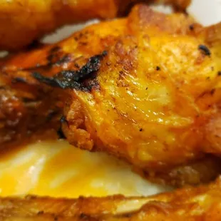 a plate of fried chicken wings