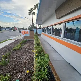 Front of building where you can see the workers busy inside.