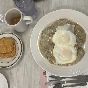 Biscuits and gravy with over easy eggs