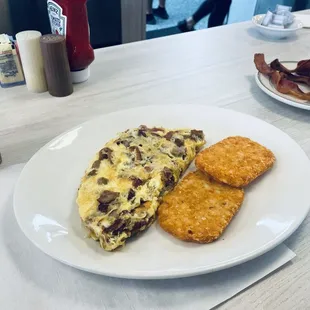 Bacon sausage &amp; Swiss omelet w hash browns