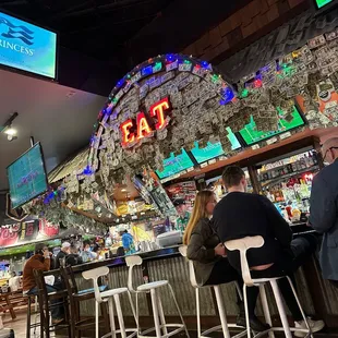 people sitting at the bar