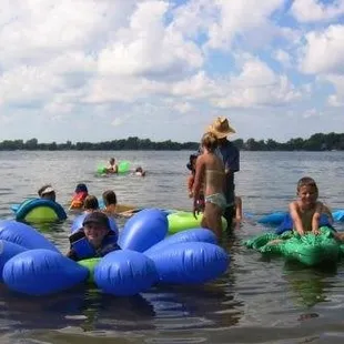 Harris &amp; Jacob in their floating water toys at Lake Florida