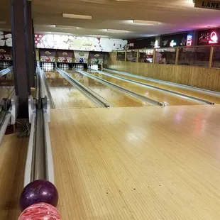 a bowling alley with bowling balls