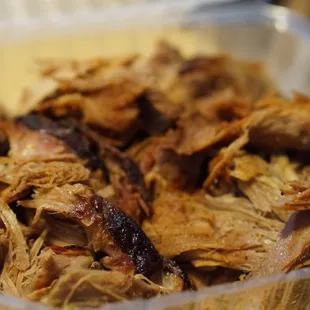 pulled pork in a plastic container