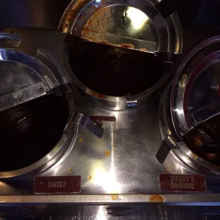 All sauce containers empty, dried and crusty inside, sauce all over, no pickles, no onions, no lemons, no pride.