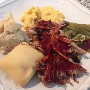 Takeout order of pulled pork with bbq sauce, Mac and cheese, green beans and bacon, and potato casserole, and bun! Amazing!!