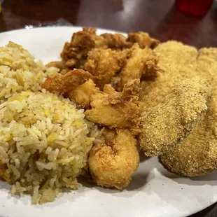 fried chicken, rice, and vegetables on a plate