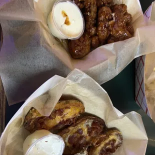 Spicy teriyaki boneless wings and potato skins.