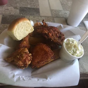 4 piece chicken dinner with coleslaw and freshly made fried potato slices