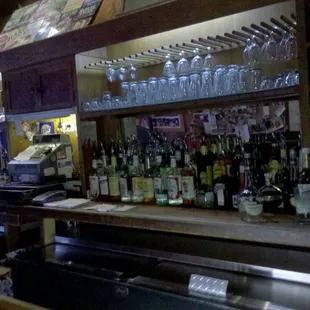 a bar filled with bottles of liquor