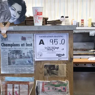 a counter with a bunch of newspapers on it