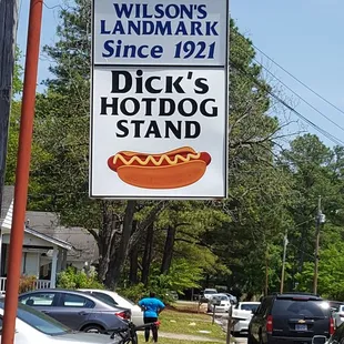 a sign for a hot dog stand