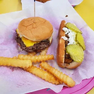 Hotdog with mustard, onion, chili, slaw and pickles and single cheeseburger with mustard, chili and slaw with free fries sample