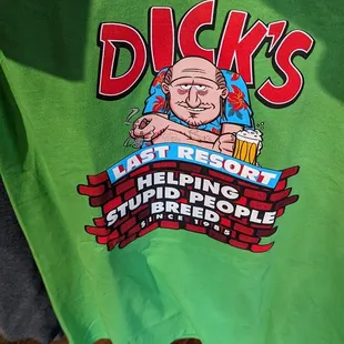 a green t - shirt with dick's last resort logo