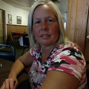 a woman sitting at a table