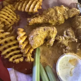 Chicken tenders tossed in Cajun ranch with waffle fries