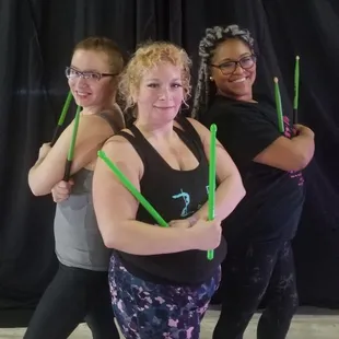 Exercise using weighted drum sticks