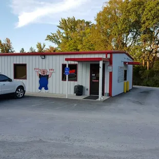 a car parked in front of a restaurant
