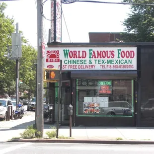 a street corner with cars parked in front of it