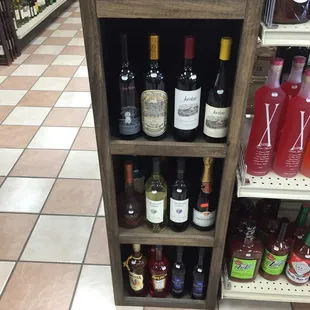 a shelf full of liquor