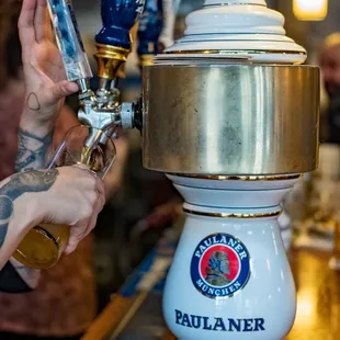 a bartender pouring a beer