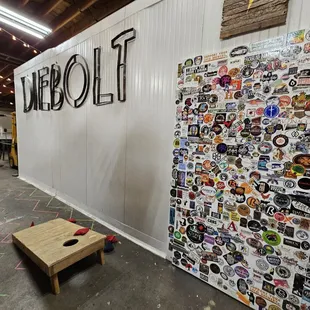 a beer fridge covered in stickers
