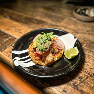 a plate of food on a wooden table