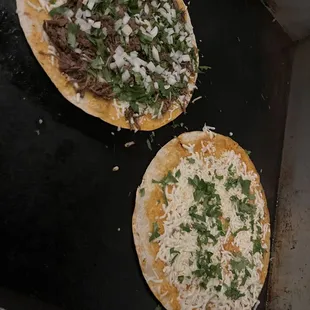 two tacos on a grill