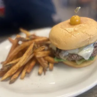 a hamburger and fries on a plate
