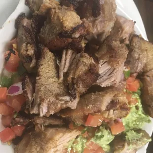 Diego special guacamole topped with grilled pork