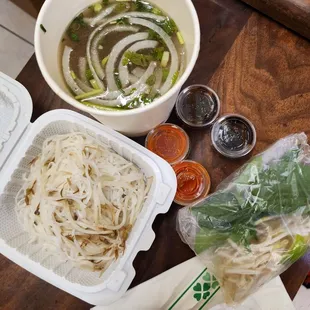 Sliced beef pho with extra Sriracha and hoisin sauce