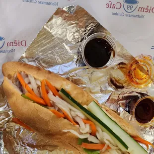 Banh Mi Dac Biet with extra side of chili oil and hoisin sauce.