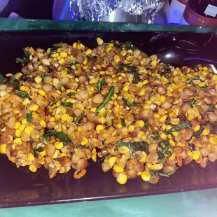 a plate of corn and greens