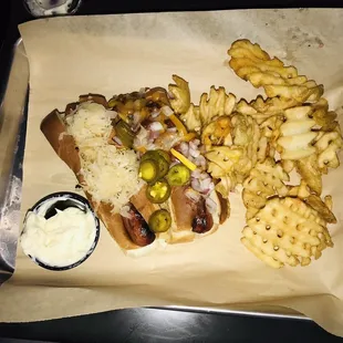 Junk Yard dog&apos;s with sauerkraut, onion, chili, jalapeños, and cheddar cheese. Yum!  I really liked these because the buns weren&apos;t too thick.