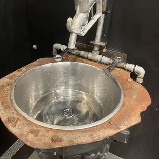 Bathroom sink (wrench are the water handles)