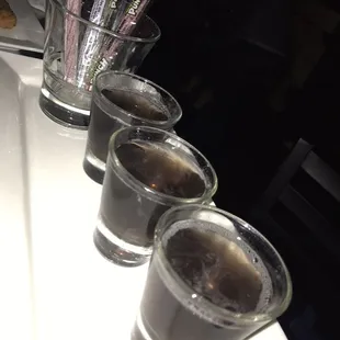 a row of shot glasses on a table