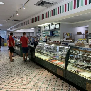 people shopping in a deli