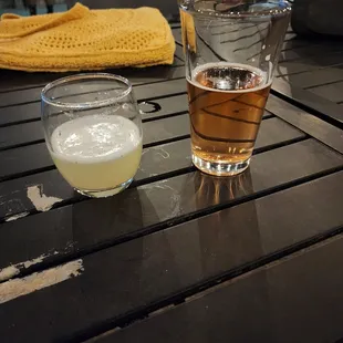 two glasses of beer on a table
