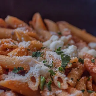 a bowl of pasta with parmesan cheese