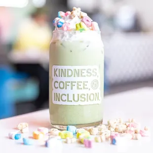 a cup of coffee with cereal sprinkles