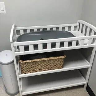 Changing table in family restroom. Even has wipes on the bottom shelf in case you forgot yours