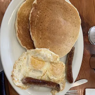 2 pancakes, 2 eggs fried over medium, and 2 chicken sausages!