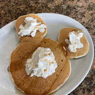 Mickey Mouse Pancake with whip cream and strawberries!
